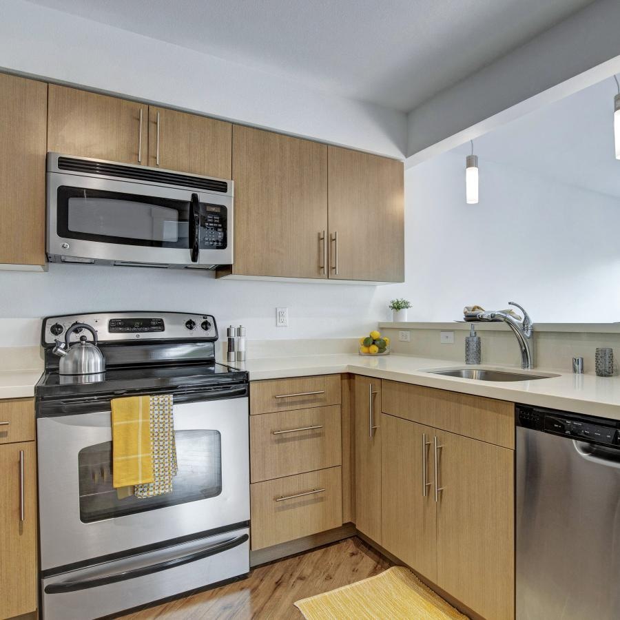 a kitchen with wooden cabinets