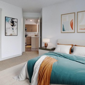 a bedroom with a bed and a lamp