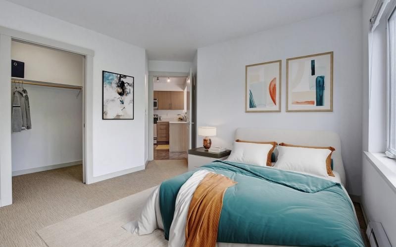a bedroom with a bed and a lamp