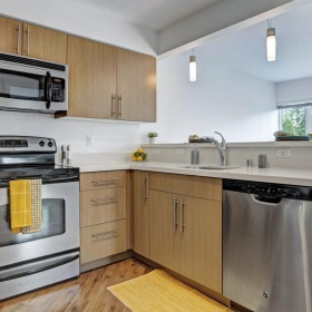 a kitchen with wooden cabinets